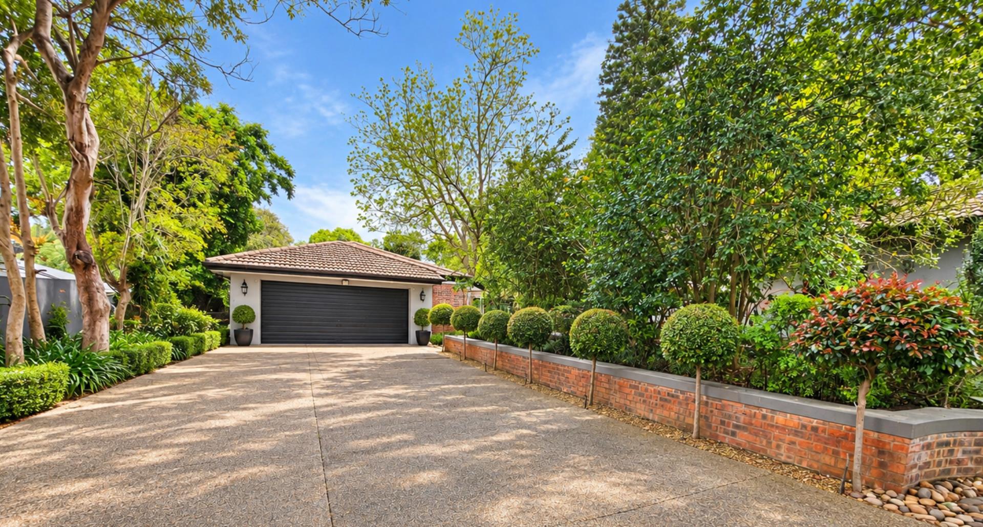 769572_Sunny_Leafy_Driveway_to_Garage.png