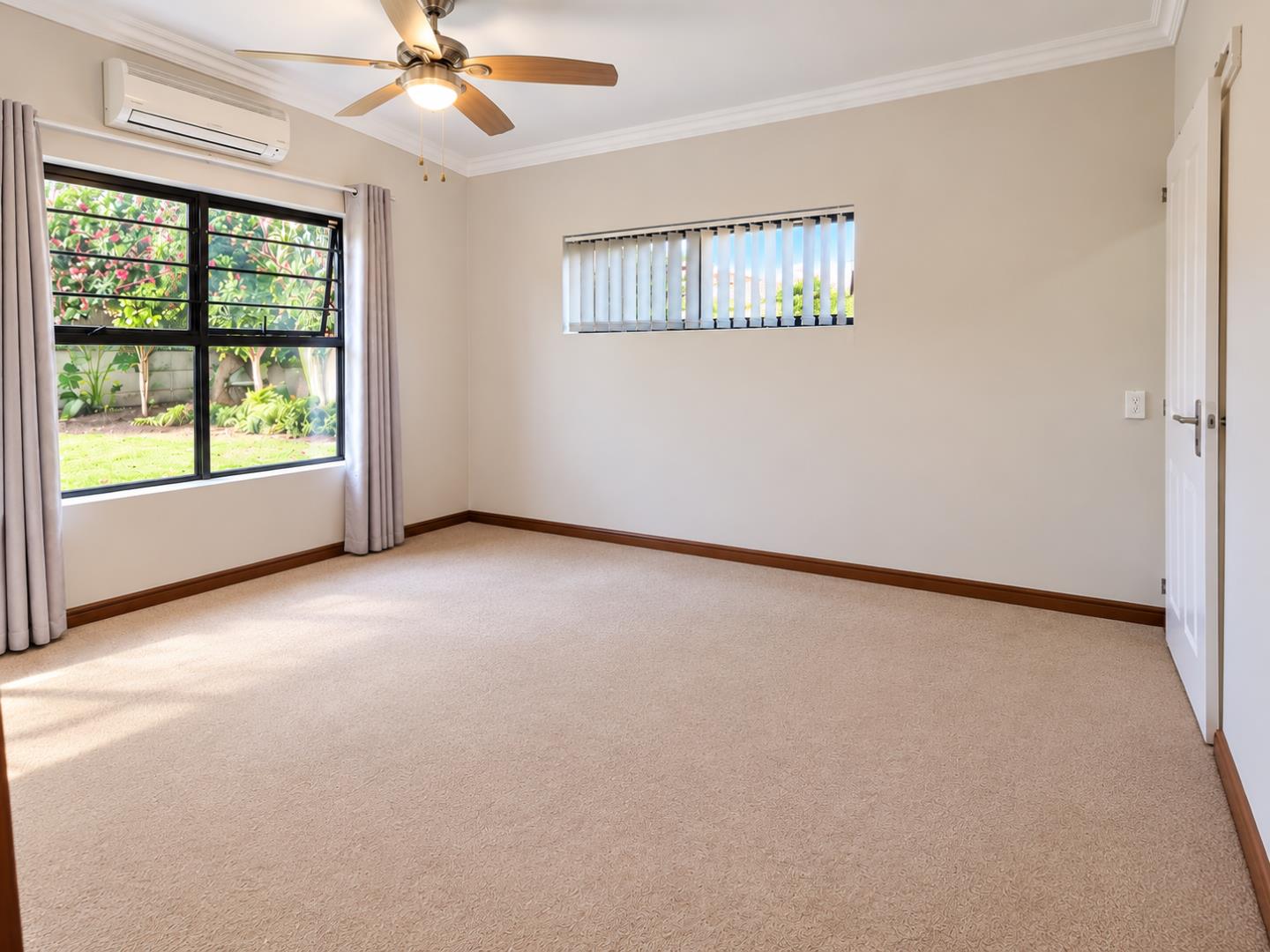 769601_Bright_Empty_Bedroom_with_Garden_Views.png