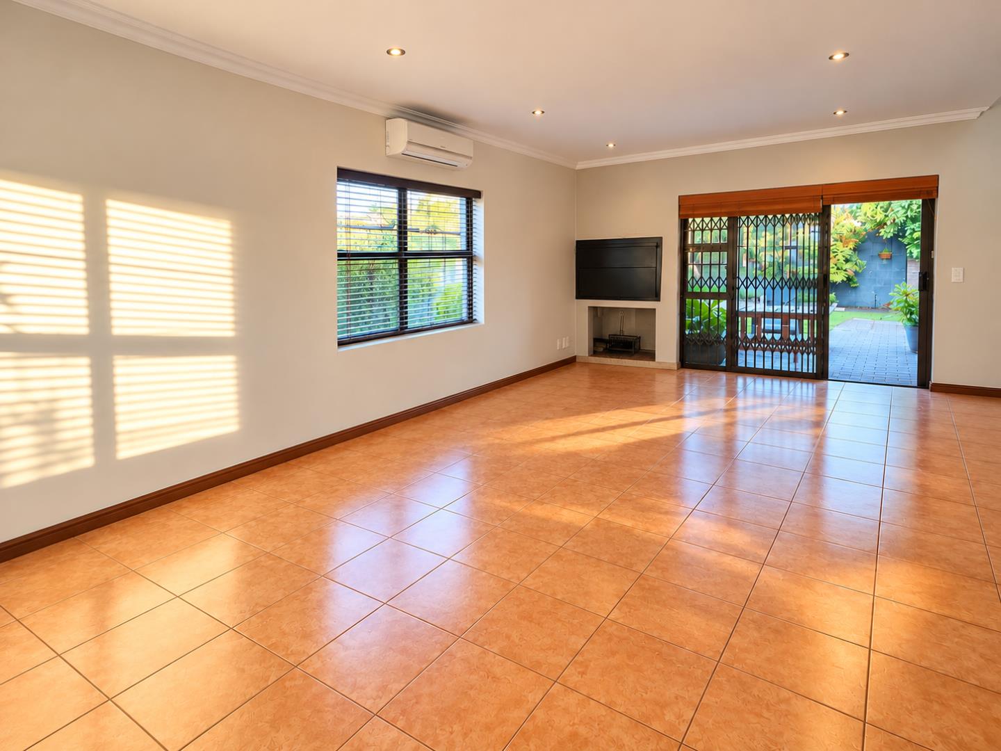 769601_Sunlit_Empty_Living_Room_Interior.png