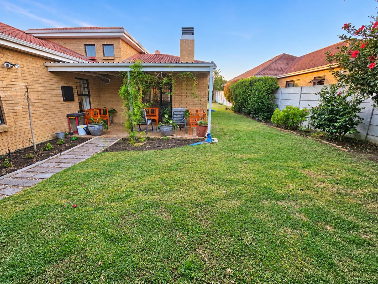 769601_Sunny_Suburban_Backyard_Patio_and_Garden.png