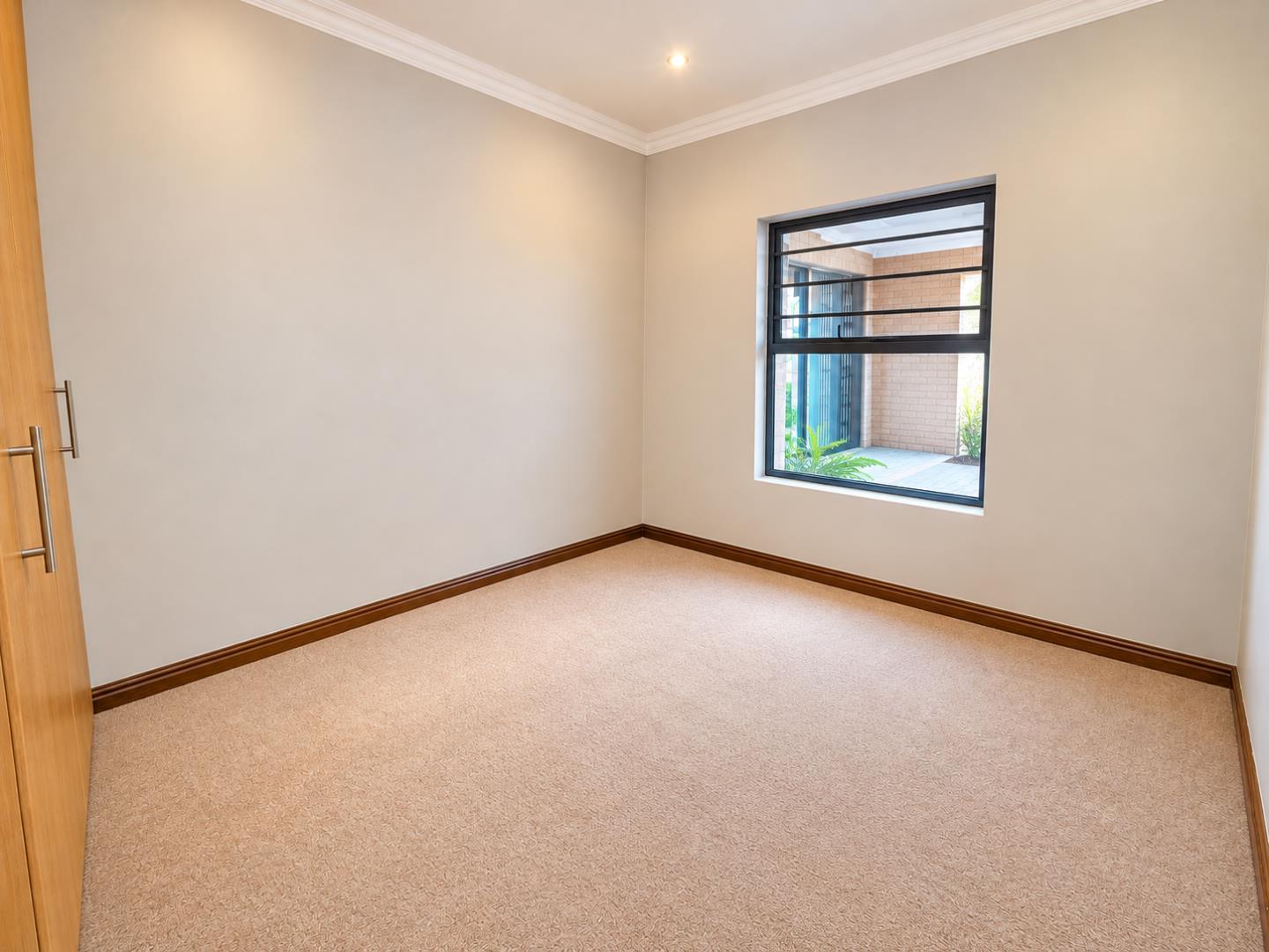 769601_Warm_Minimalist_Room_with_Wardrobe_and_Window.png